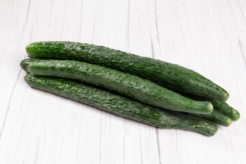 fresh cucumbers on wooden table