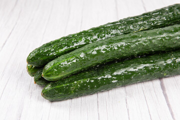 fresh cucumbers on wooden table