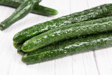 fresh cucumbers on wooden table