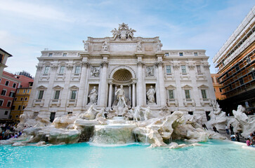 Fototapeta na wymiar Trevi fountain with clear blue water against vintage Rome building as popular tourist destination. Historical sculpture and architecture sightseeing on May 06 in Rome
