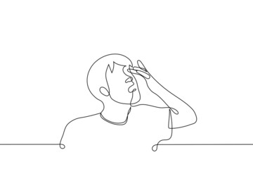 man rubs his eye with a finger or inserts a lens - one line drawing vector. the concept of vision problems, conjunctivitis, correct the lens