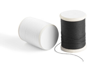 white and black sewing thread spool on a white