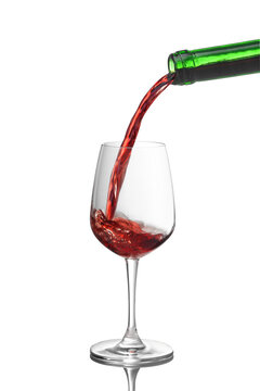 Red wine pouring into glasses