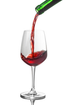 Red wine pouring into glasses