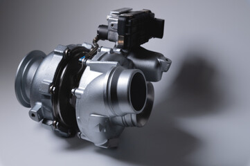 New car parts turbocharged, on a light background.