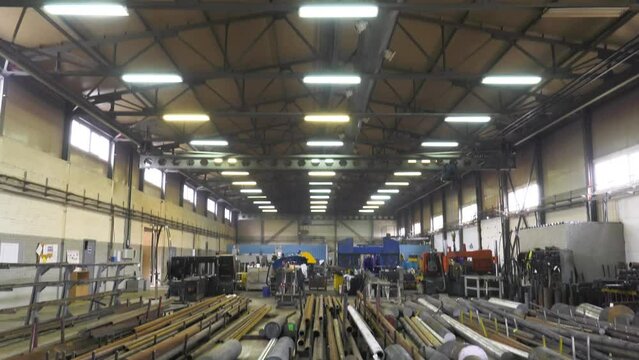 Technovek - oil and gas equipment manufacturing plant. Metal rolling blanks in the workshop.