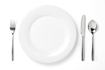 Empty plate with spoon, knife and fork isolated on a white