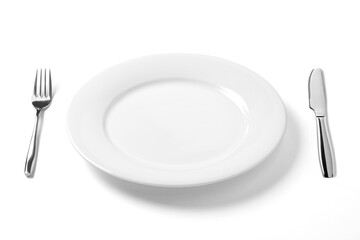 Empty plate with knife and fork isolated on a white background.