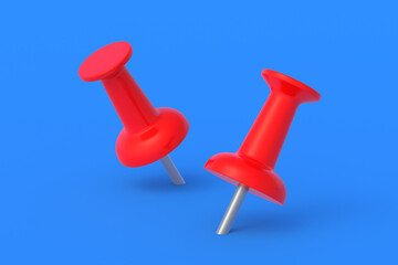 Push pins on blue background. Stationery tools. Office equipment. School education. 3d render