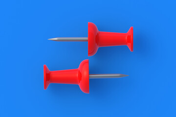 Push pins on blue background. Stationery tools. Office equipment. School education. Top view. 3d render