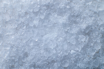Coarse white iodized salt. Detailed background texture Macro close-up. Salt crystals of different sizes