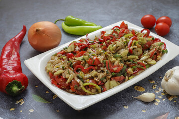 Turkish and Arabic Traditional Salad Gavurdagi on wood table
