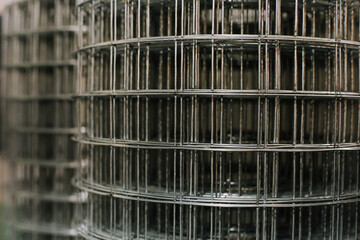 Big rolls of iron building grid - close up photo with selective focus