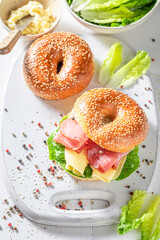 Delicious and healthy bagel with cheese and prosciutto.