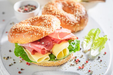 Homemade and crunchy bagel with ham and cheese.