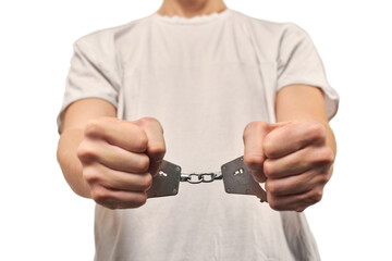 Hands of criminal in handcuffs, arrest of dangerous criminal, violation of law, white background