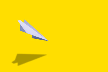education or innovation concept. paper origami plane over yellow background