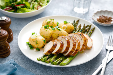 Roasted chicken breast, boiled new potato and grilled asparagus