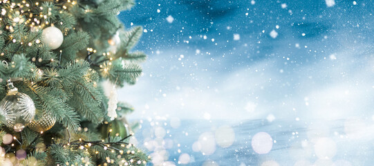 banner. blue christmas decoration, postcard. on the tree a snowflake, balls and a garland