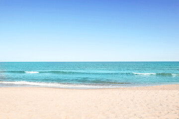 Picturesque view of sandy beach near sea