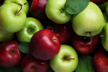 Fresh ripe green and red apples as background, top view