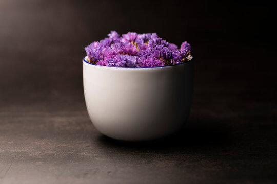 Blue Dried Flowers In A Coffee Cup