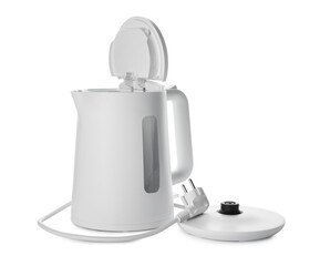 Modern electric kettle with base and plug isolated on white