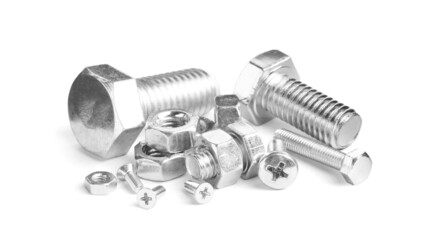 Different metal bolts and nuts on white background