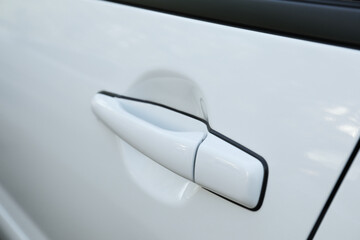 Closeup view of car door with handle