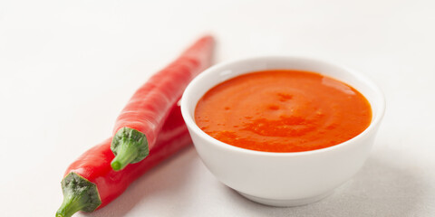 Freshly Sriracha Hot chilli Sauce in bowl on the table.