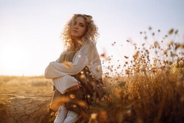 Young woman resting in nature. People, lifestyle, relaxation and vacations concept. Fashion, style...