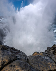 waves crashing on clifs