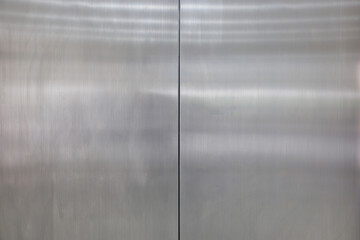 stainless steel door background and texture. elevator metal door.
