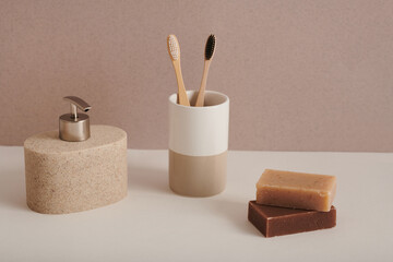 Contemporary still life composition of minimalistic bathroom accessories set with toothbrushes and soap bars