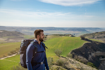 Fototapeta premium Bearded young man looking into infinity with plenty of copy space