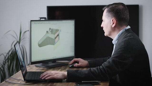 A senior engineer works for an industrial corporation designing parts for automobiles.