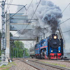 Fototapeta na wymiar Retro steam train moves.
