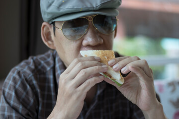 portrait one person eating a meal sandwich bread,absolutely delicious