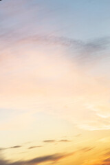 Vertical ratio size of sunset background. sky with soft and blur pastel colored clouds. gradient...