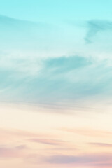 Vertical ratio size of sunset background. sky with soft and blur pastel colored clouds. gradient cloud on the beach resort. nature. sunrise.  peaceful morning. Instagram toned style - obrazy, fototapety, plakaty