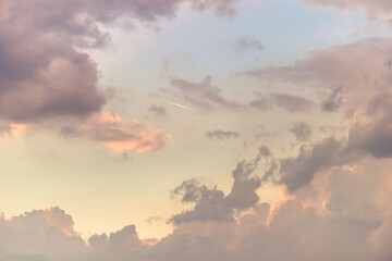 Twilight sky with effect of light pastel colors. Colorful sunset of soft clouds.