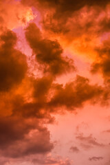 Twilight sky with effect of light pastel orange colors. Colorful sunset of soft clouds.