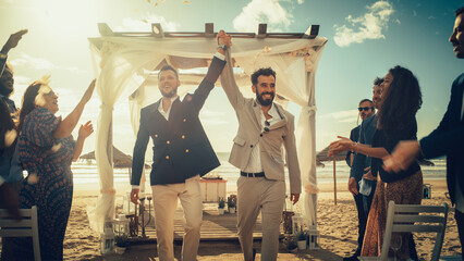 Handsome Gay Couple Walking Up the Aisle at Outdoors Wedding Ceremony Venue Near Sea. Two Happy Men...