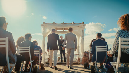 Handsome Gay Couple Walking Down the Aisle at Outdoors Wedding Ceremony Venue Near the Sea. Two...