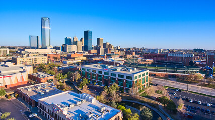 Fototapeta na wymiar Aerial over shopping area in Oklahoma City with downtown in distance