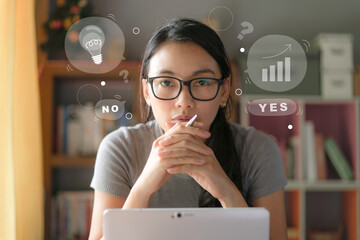 Businesswoman sitting and thinking for choose about investment about yes or no