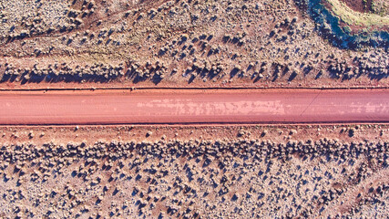 Desert plains aerial looking down at dirt road
