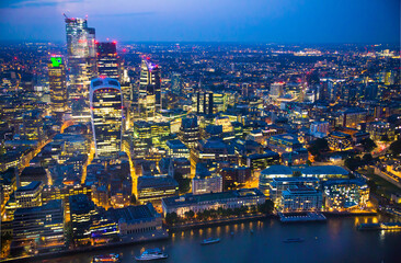 Fototapeta premium City of London at sunset. View include modern skyscrapers, banks and office buildings and river Thames