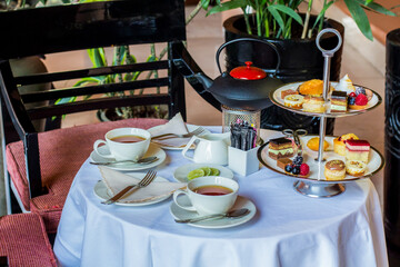 Tea table with desserts, Photo is selective focus with shallow depth of field.