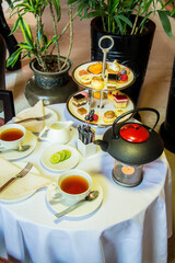 Tea table with desserts, Photo is selective focus with shallow depth of field.